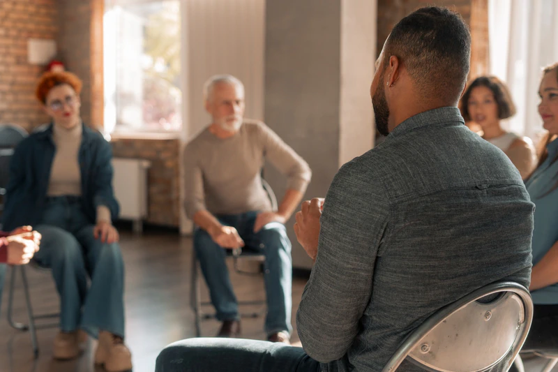 Man participating in group therapy session
