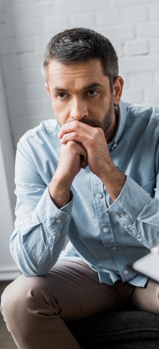 A man thinks during an individual therapy session