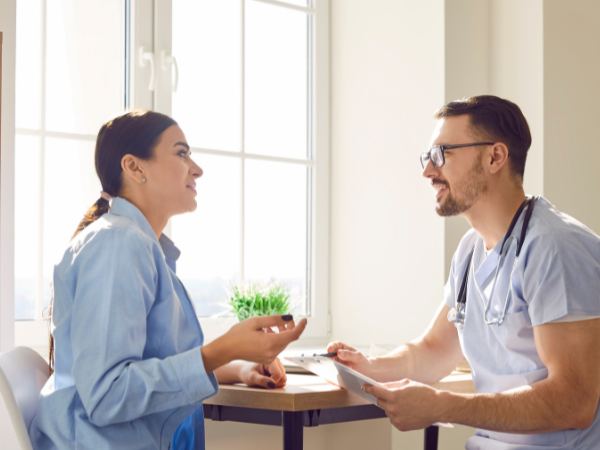 A medical professional and client discuss the addiction detox process